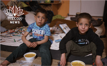 Ukrainian Refugee Children with food/prasadam in Hungary 